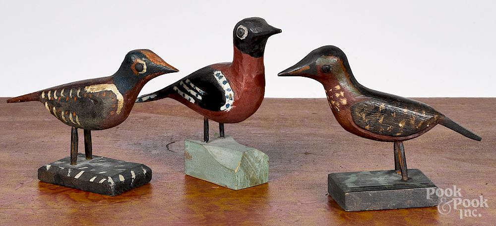 Appraisal: Three carved and painted birds Three carved and painted birds