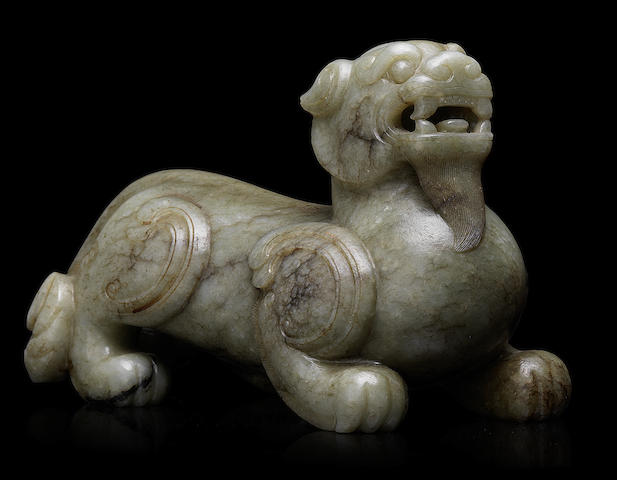 Appraisal: A rare striated pale green jade carving of a bixie