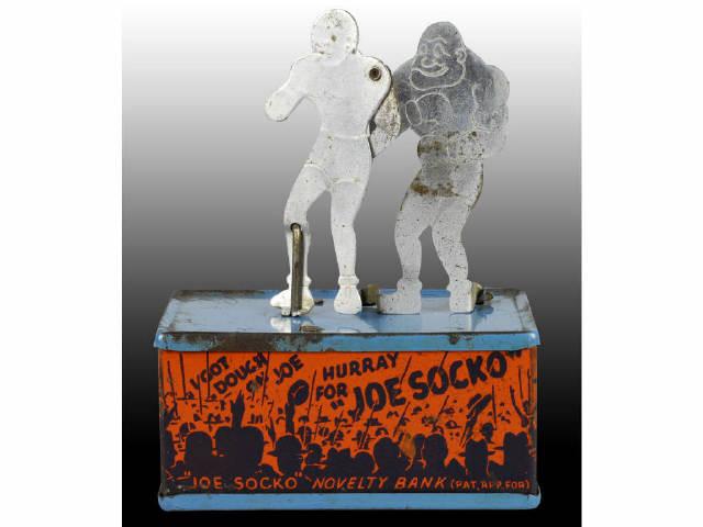 Appraisal: Tin Joe Socko Mechanical Bank Description Working Trap and key