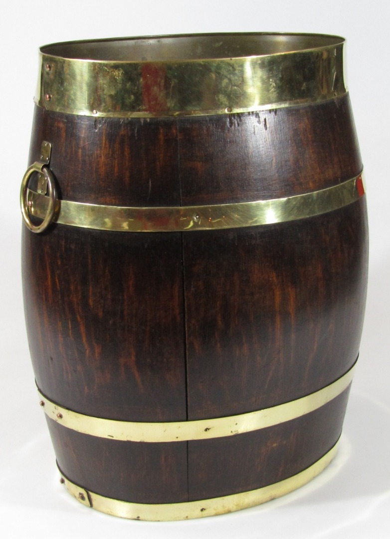 Appraisal: A thC coopered barrel with brass banding on oval foot