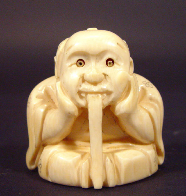 Appraisal: Oriental ivory Netsuke in the form of an elder resting