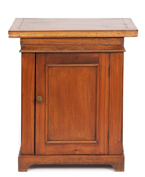 Appraisal: An American mahogany cabinet with fitted porcelain sink height in