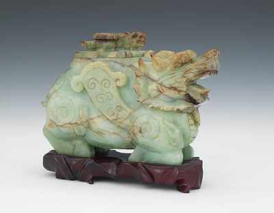 Appraisal: Recumbent Jade Monster Vessel with Small Monster on Lid Well-carved