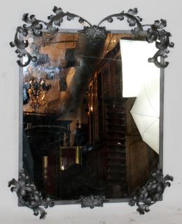 Appraisal: Iron foliate framed mirror Iron foliate framed mirror h x