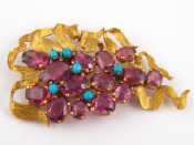 Appraisal: A yellow metal tests carat gold garnet and turquoise brooch