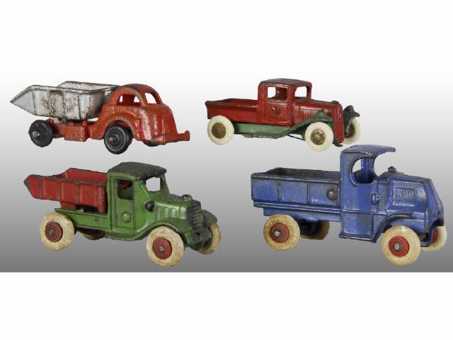 Appraisal: Lot of Cast Iron Work Truck Toys Description Various colors