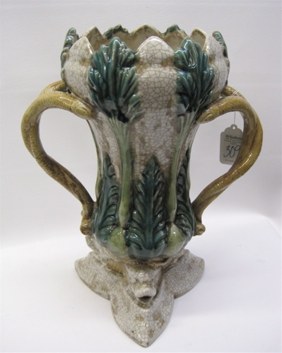 Appraisal: MAJOLICA STYLE POTTERY UMBRELLA STAND with double serpentine handles Height