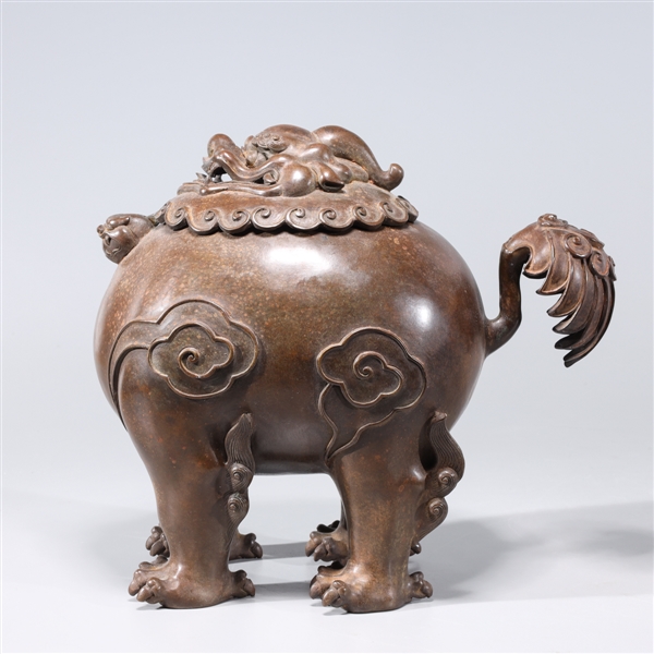 Appraisal: Chinese lion form incense burner four-character mark to base overall