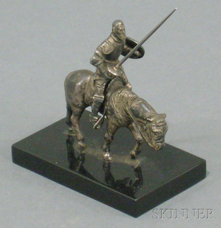 Appraisal: Small Silvered Metal Figure of Don Quixote th century the