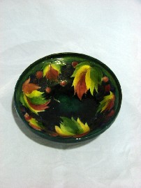 Appraisal: A Moorcroft blue ground Leaf and Berry footed bowl c