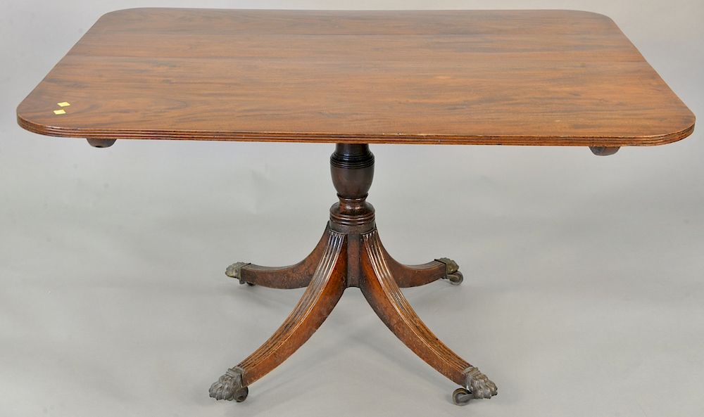 Appraisal: George IV mahogany breakfast tip table with brass paw feet