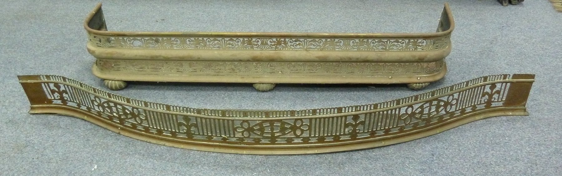 Appraisal: A pierced brass serpentine fire curb cm wide and a