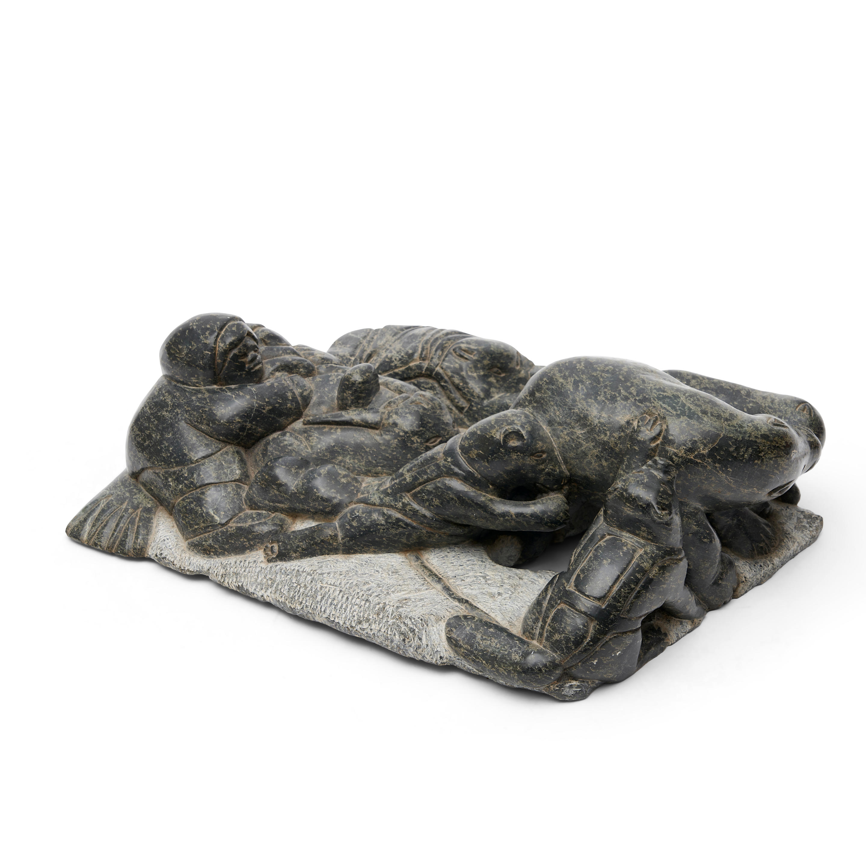 Appraisal: INUIT CARVED STONE SCULPTURE OF A HUNTING PARTY in the