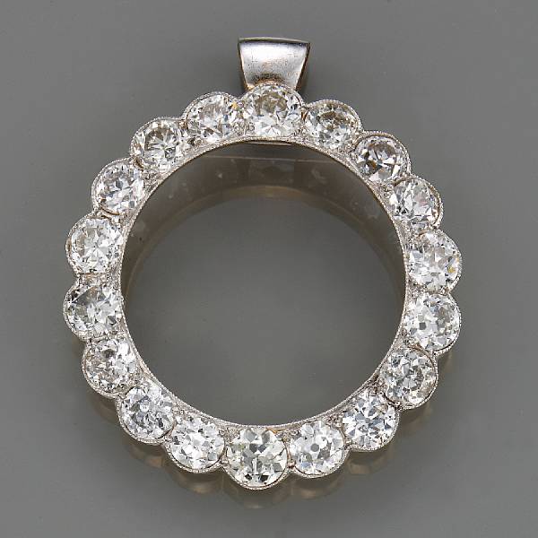 Appraisal: A diamond and platinum-topped eighteen karat gold circle pendant with