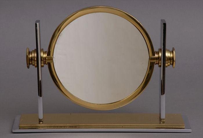 Appraisal: KARL SPRINGER CHROME AND BRASS DRESSING TABLE MIRROR The circular