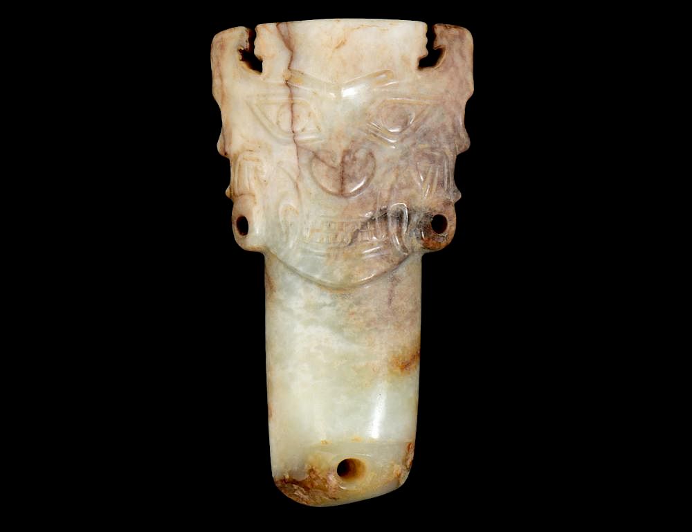 Appraisal: CHINESE ARCHAISTIC CALCIFIED JADE MASK With three pierced holes and