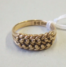 Appraisal: A Victorian ct gold keeper ring in a beaded and