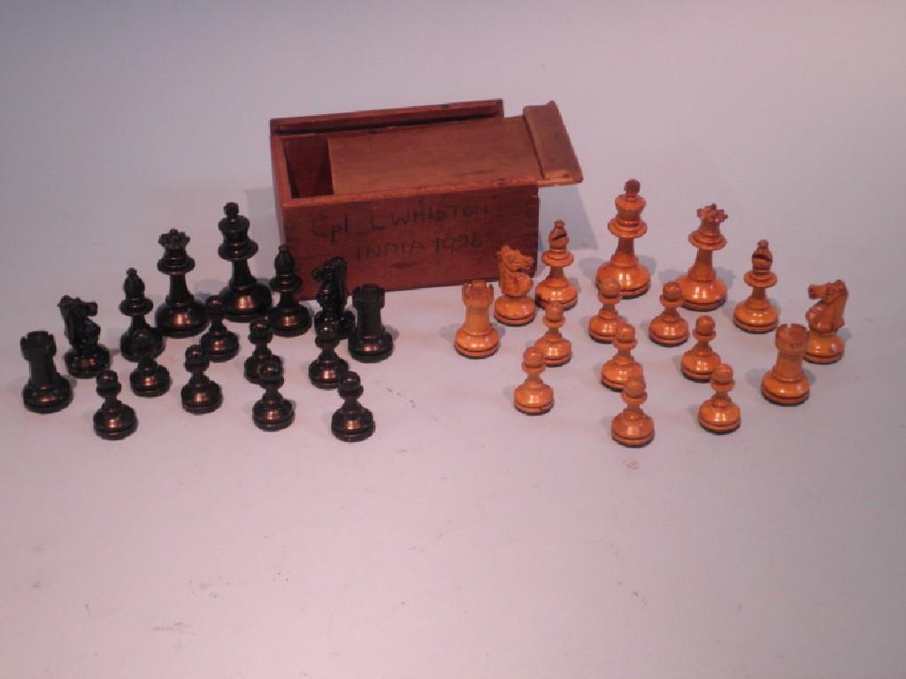 Appraisal: A set of carved and stained wooden chess pieces in