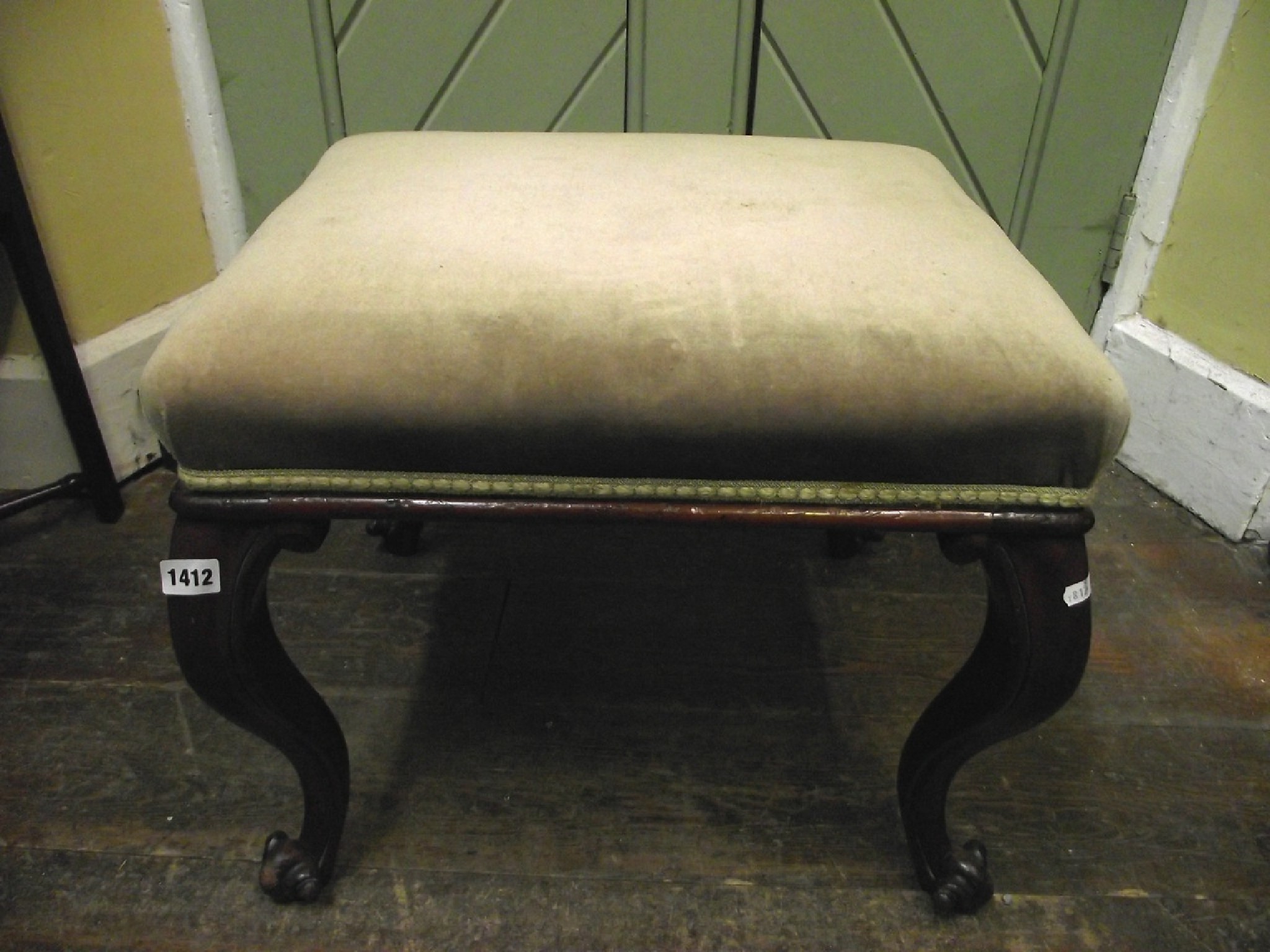 Appraisal: A Victorian mahogany centre stool of rectangular form raised on