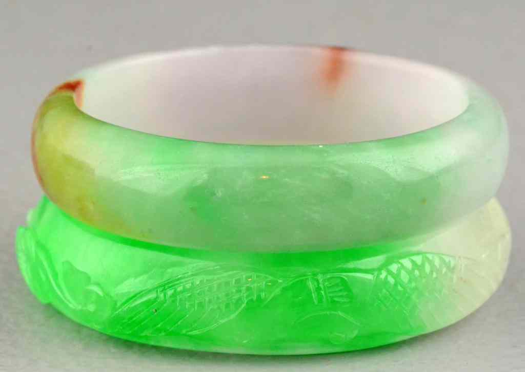 Appraisal: Chinese Carved Jade BanglesOne finely carved to depict koi fish