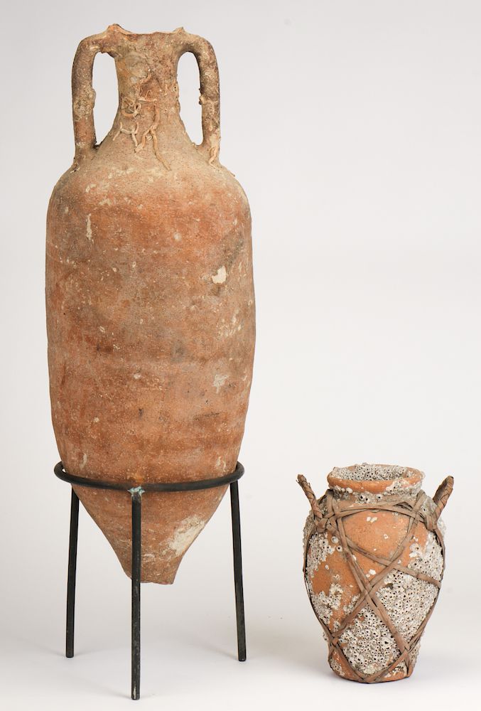 Appraisal: Ancient Terracotta Cargo Amphora on Stand and a Rafia-Strapped Vessel