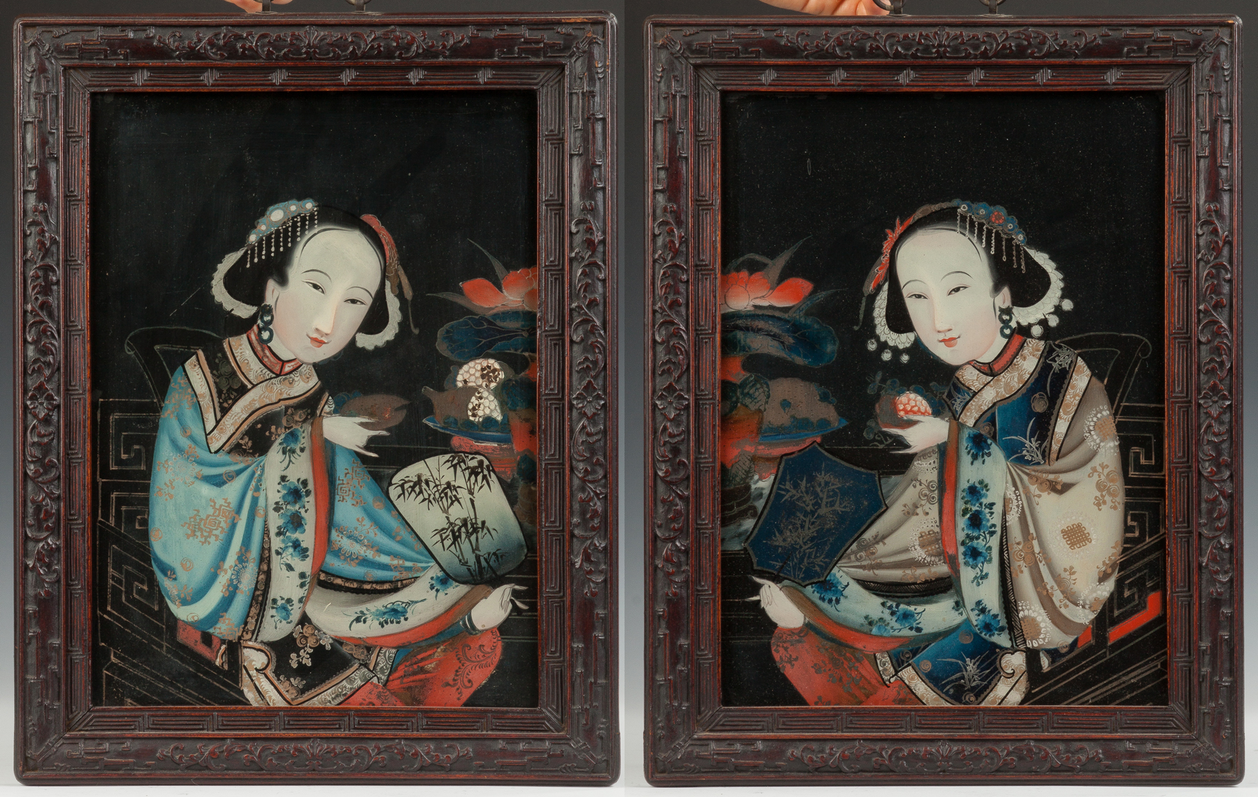 Appraisal: Two Chinese Portraits th century Paintings on glass with carved