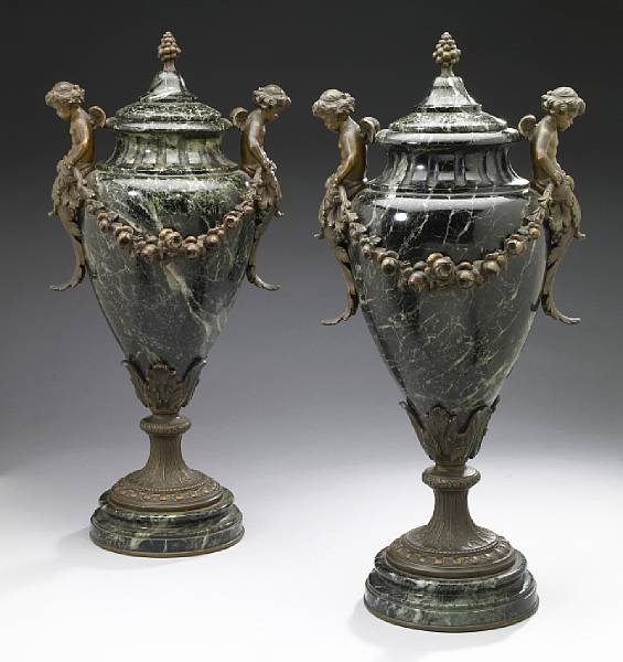 Appraisal: A pair of bronze mounted verde antico marble covered urns