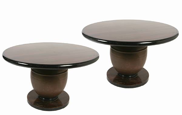 Appraisal: A pair of ebonized dining tables th century the circular