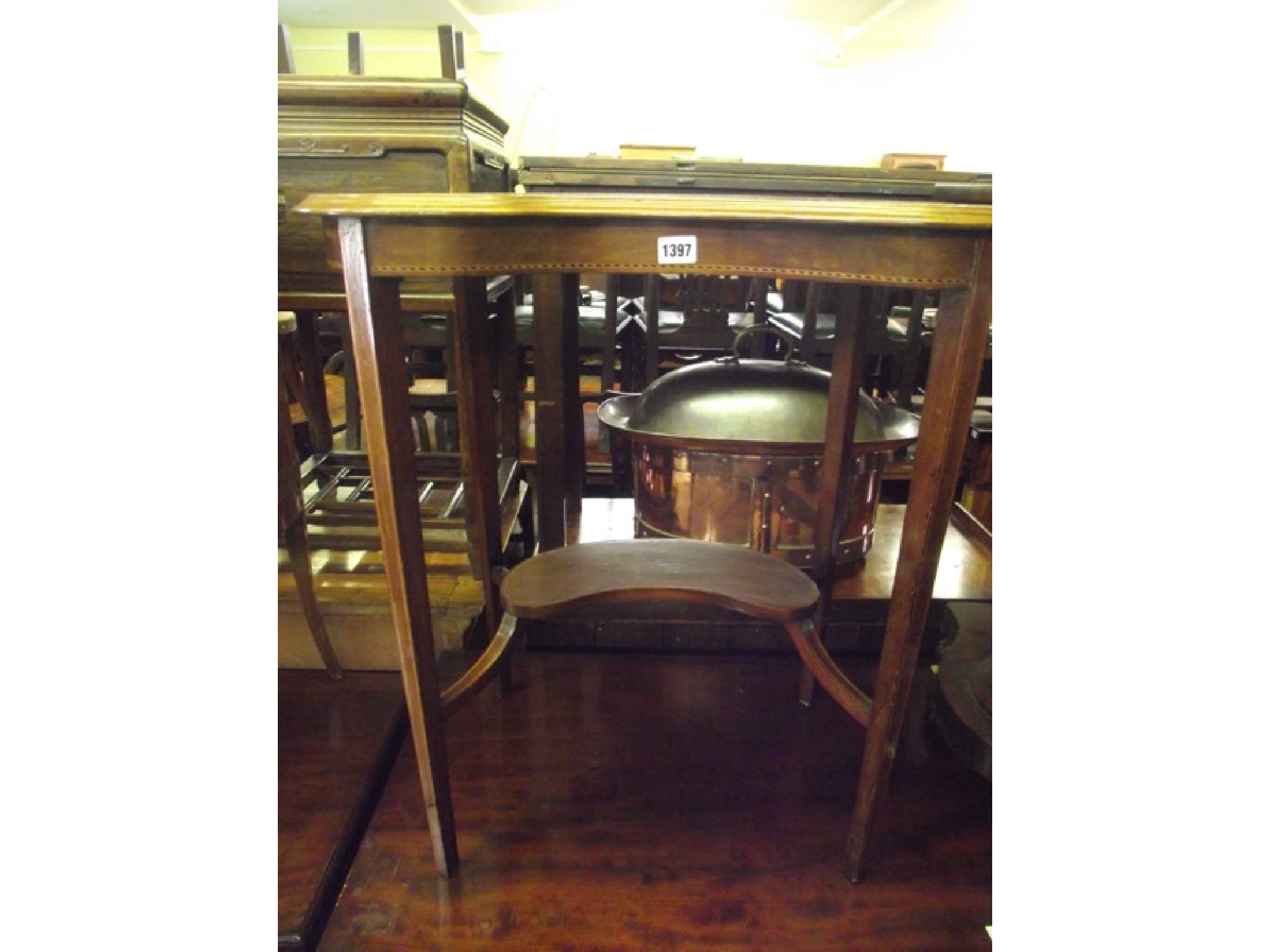 Appraisal: An inlaid Edwardian mahogany kidney shaped side table on two