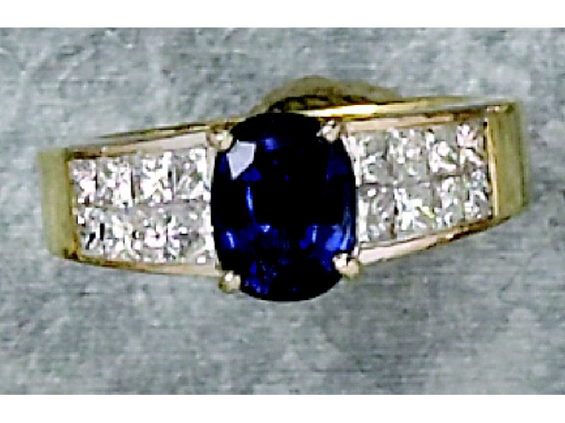 Appraisal: SAPPHIRE AND DIAMOND RING k yellow gold invisible set semi