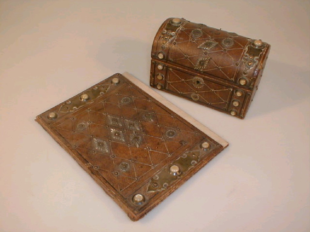 Appraisal: A leather bound stationary box with domed cover and mounted