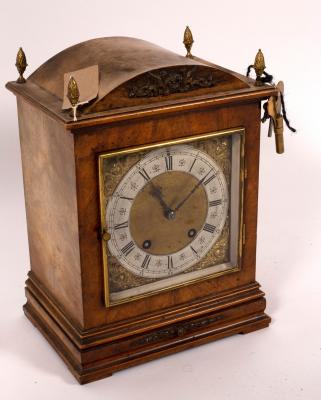 Appraisal: A German walnut cased mantel clock the square dial with