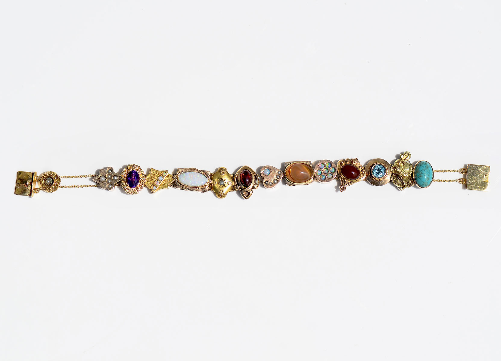 Appraisal: K GOLD MULTI-GEMSTONE SLIDE BRACELET Slides containing Opals Garnets Seed