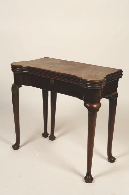 Appraisal: A GEORGE II MAHOGANY TRIPLE TOP GAMES TABLE with a