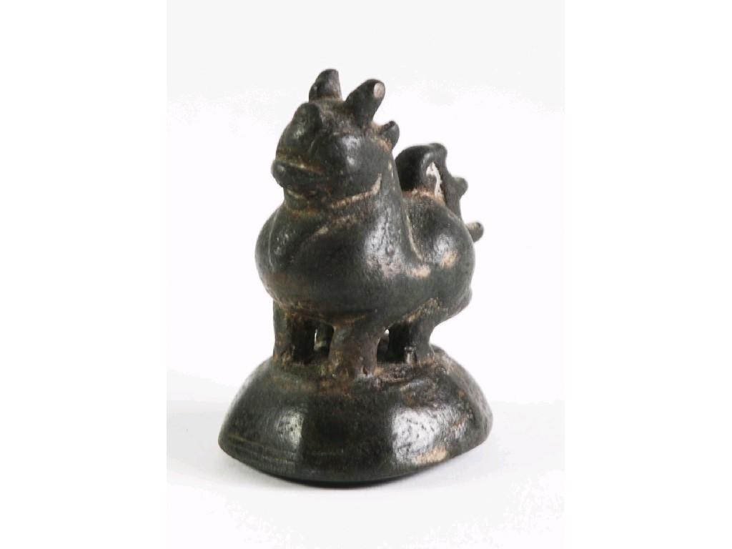 Appraisal: BURMESE PATINATED BRONZE PAPER OPIUM WEIGHT modelled as a mythical