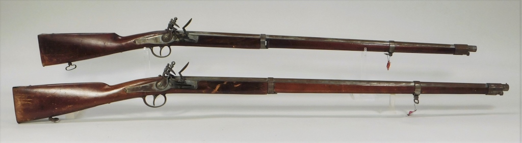 Appraisal: TWO DECORATIVE BELGIAN-MADE MUSKETS Belgium C s bore walnut stocks