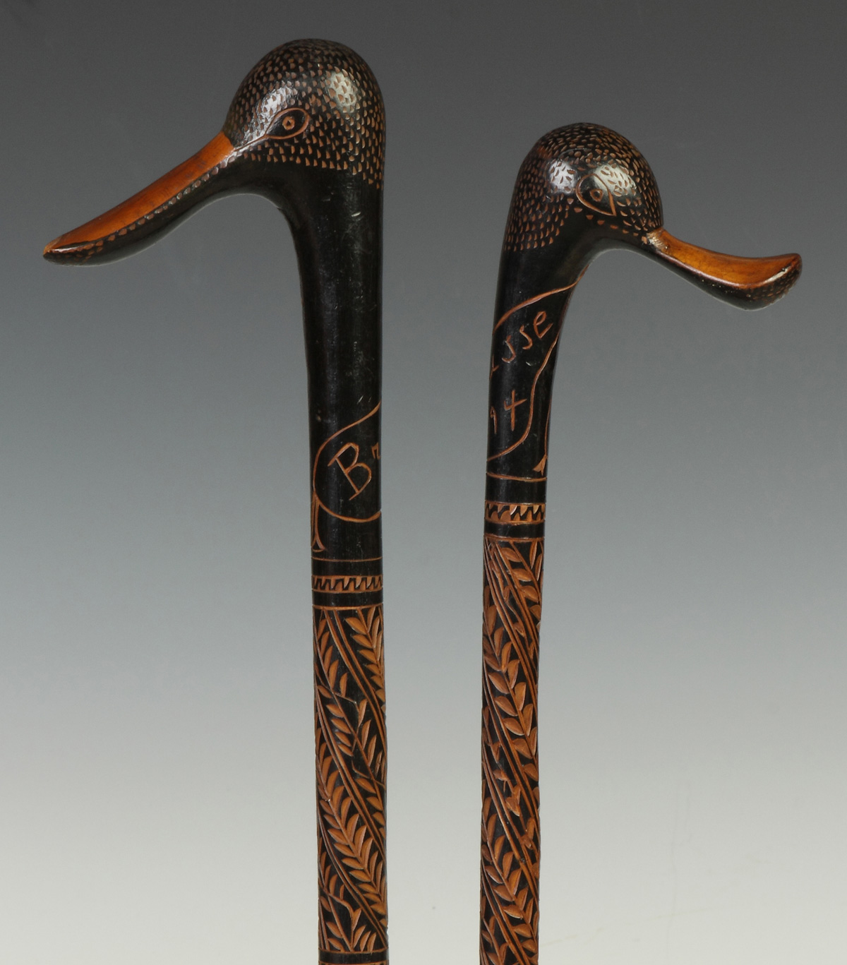 Appraisal: Two Carved Wood Canes w Duck Handles Both inscribed Brousse