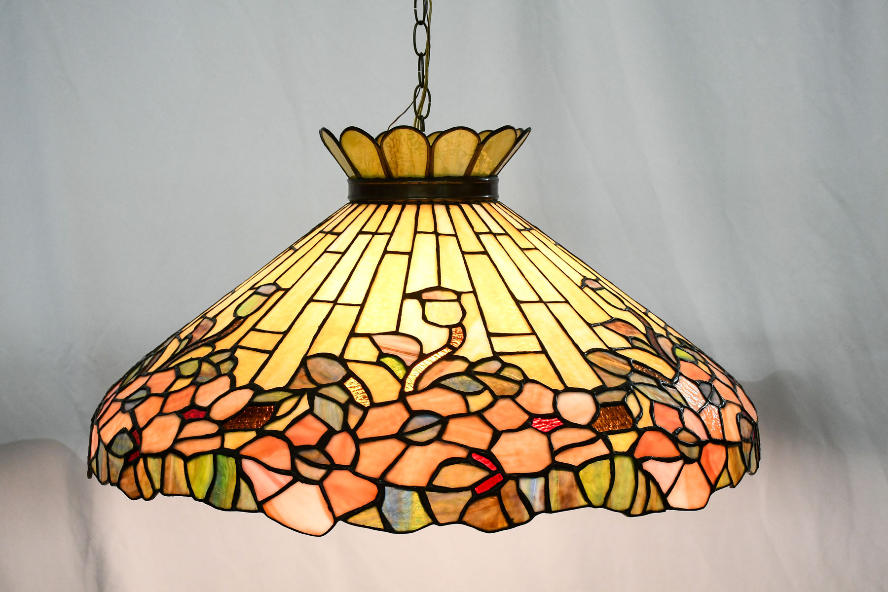 Appraisal: HANGING FLORAL MOTIF LEADED GLASS HANGING LIGHT Large stained glass