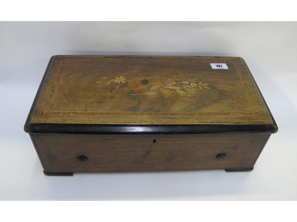 Appraisal: A Swiss musical box stamped RRG in an inlaid rosewood