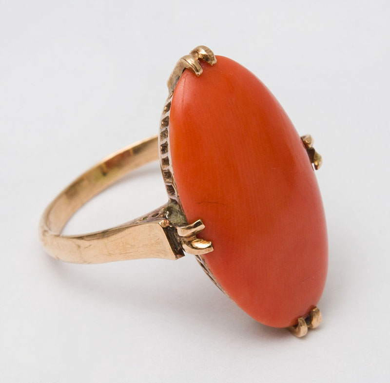 Appraisal: EDWARDIAN K GOLD AND CORAL RING Gold basket mount set