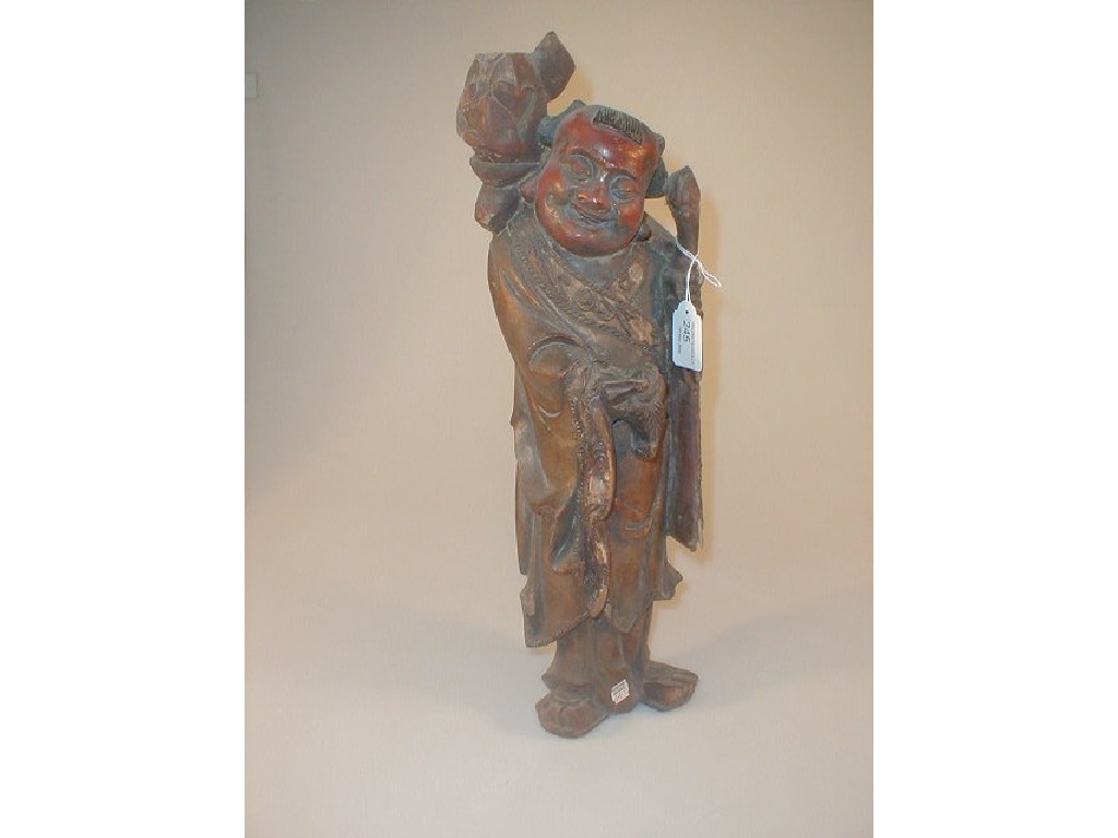 Appraisal: A Chinese carved gilded and painted wooden figure of a