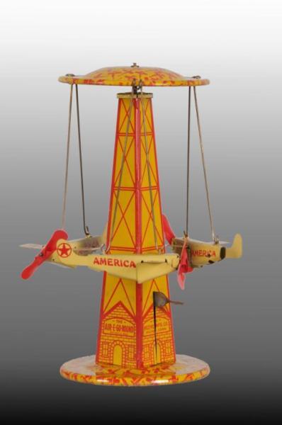 Appraisal: Tin Reeves Air-E Go-Round Wind-Up Toy Description Working Includes original