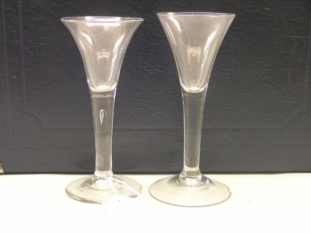 Appraisal: Two mid th century 'drawn trumpet' wine glasses one with