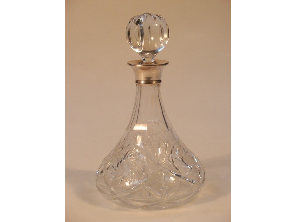 Appraisal: A cut glass ship's decanter with a silver collar modern