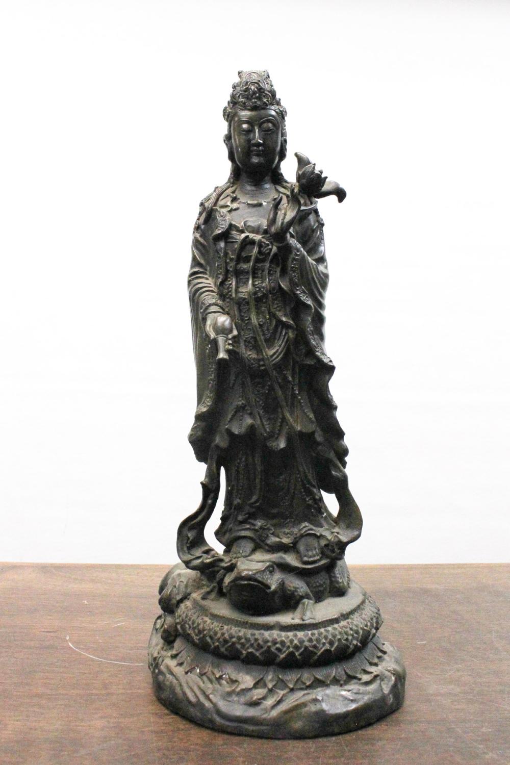 Appraisal: CHINESE BRONZE GUANYIN SCULPTURE the standing figure with flowing robe