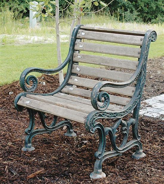 Appraisal: Pair cast-iron and wood garden seats scrolling side panels with