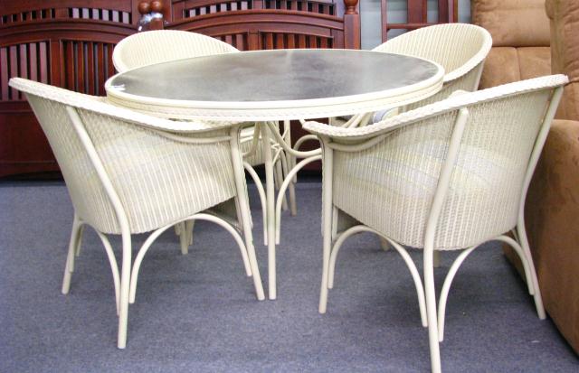 Appraisal: Lloyd Flanders patio set including glass-top table and four chairs