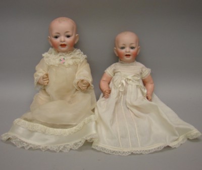 Appraisal: Pair of solid dome character babies L cir Baby has