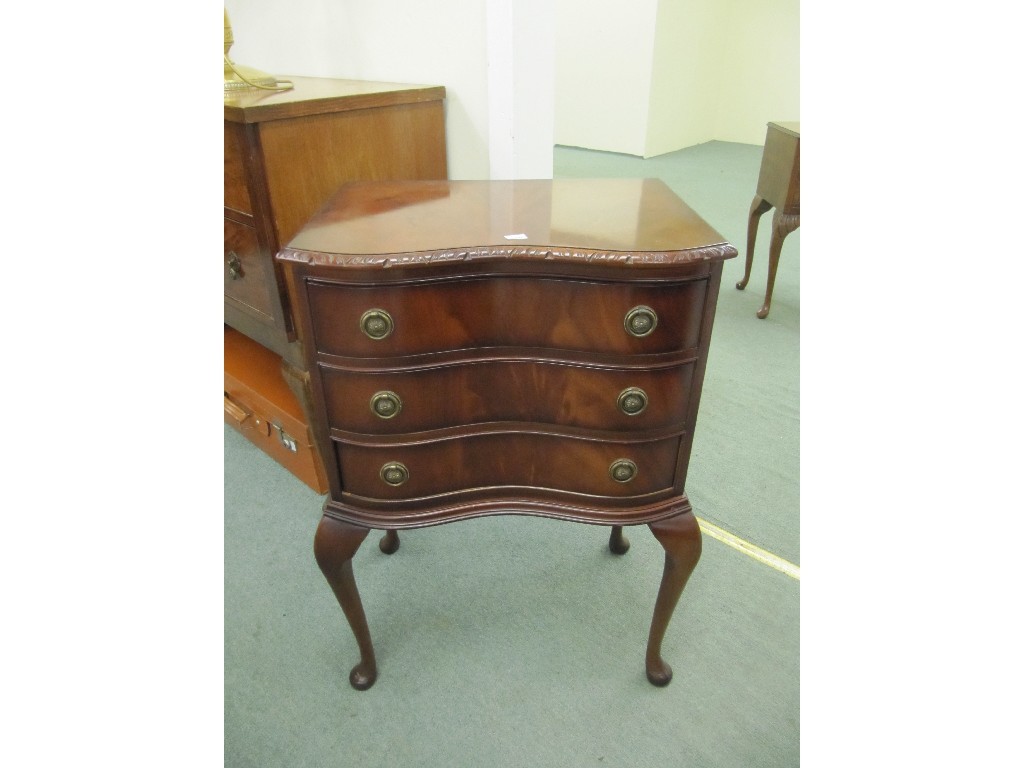 Appraisal: Reproduction serpentine three drawer chest of drawers