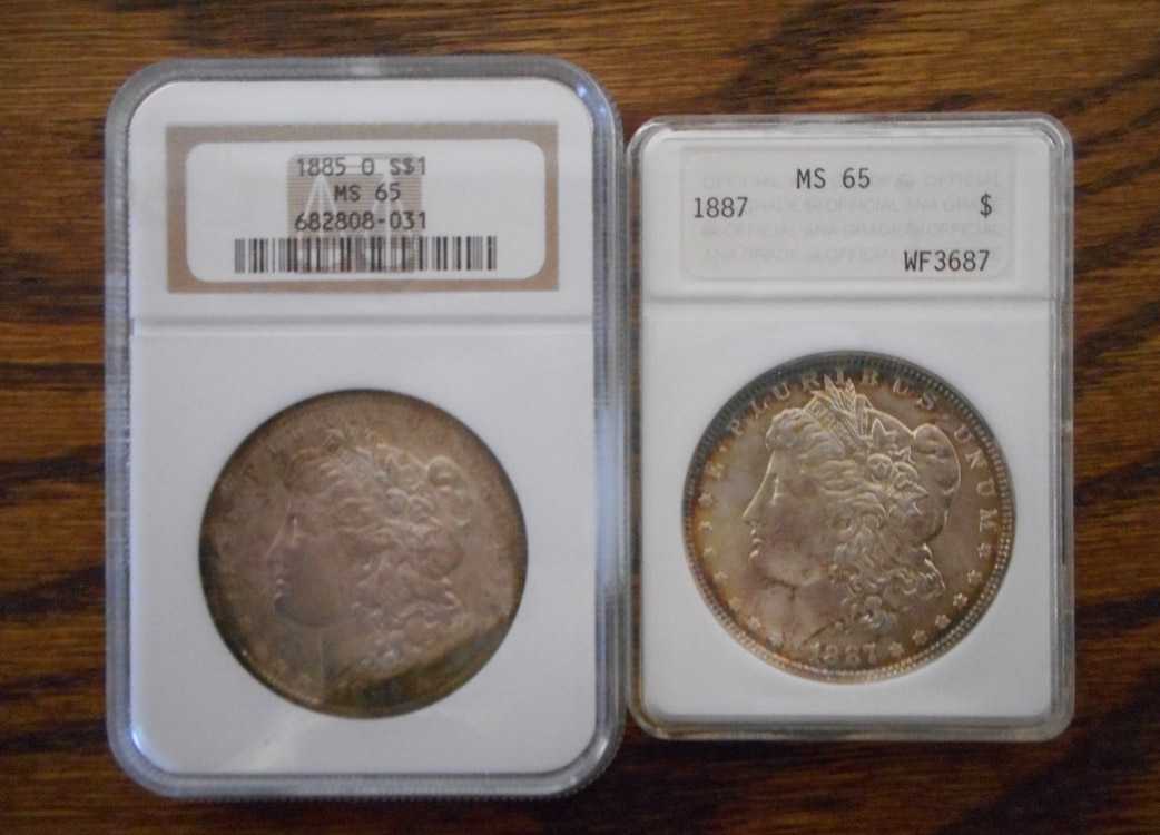 Appraisal: TWO U S SILVER MORGAN DOLLARS -O NGC cased and